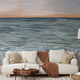 "Cozy living room featuring Wall Blush New Beginnings Wallpaper with serene ocean view design."