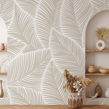 "Wall Blush Ohana Wallpaper in modern living room with stylish neutral-toned leaf design."