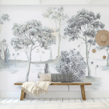 "Otilia Wallpaper by Wall Blush enhancing a serene living room interior, highlighting elegant tree motifs."