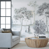 "Otilia Wallpaper by Wall Blush featuring serene tree design in a modern living room setting, main focus on wall decor."
