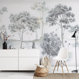 "Otilia Wallpaper by Wall Blush in a modern living room setting, featuring elegant tree designs as the focal point."