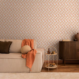 "Peachy Plaid Wallpaper by Wall Blush in a cozy living room setup, accented with stylish decor and furniture."