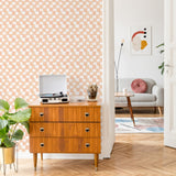 Wall Blush Peachy Plaid Wallpaper in modern living room, mid-century furniture, focus on wall decor.
