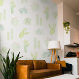 "Wall Blush's Petals and Prickles (Large) Wallpaper adds a botanical touch to a stylish living room space."