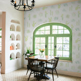 "Wall Blush's Petals and Prickles (Small) Wallpaper in a bright dining room, highlighting the charming wall decor focus."