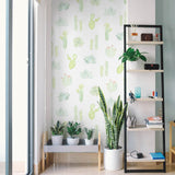 "Wall Blush 'Petals and Prickles (Small) Wallpaper' in a modern home office with cactus-themed decor."