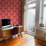"Stylish home office featuring Wall Blush's Margot Wallpaper with vibrant star pattern design."
