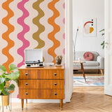 "Wavy Polly Wallpaper by Wall Blush enhances the modern living room decor with vibrant patterns and style."