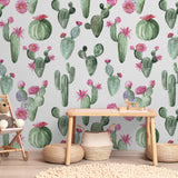 Wall Blush's Prickly Princess Wallpaper in a cozy nursery room, showcasing vibrant cactus patterns.
