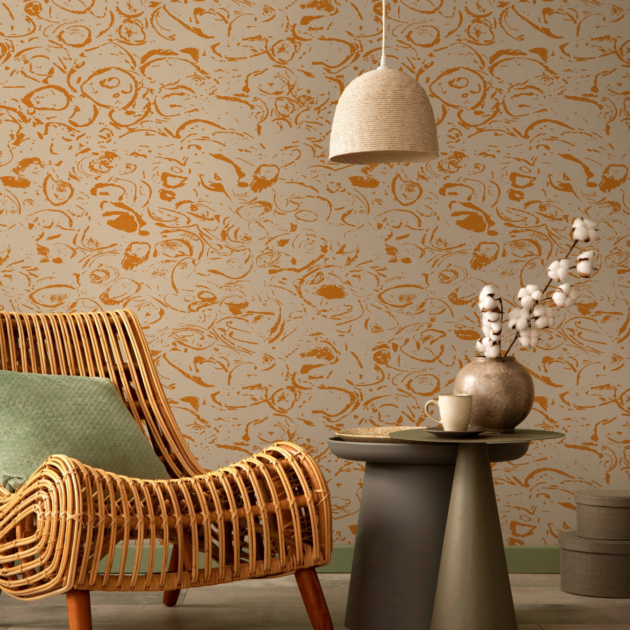 "Wall Blush Ranger Wallpaper featured in stylish modern living room with rattan chair and pendant lamp."