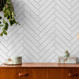 Stitch Wallpaper by Wall Blush in a modern room, with herringbone pattern focus on wall decor.
