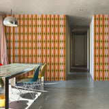 "Wall Blush 'THAT GIRL Wallpaper' featured in modern dining room interior, highlighting vibrant wall decor focus."