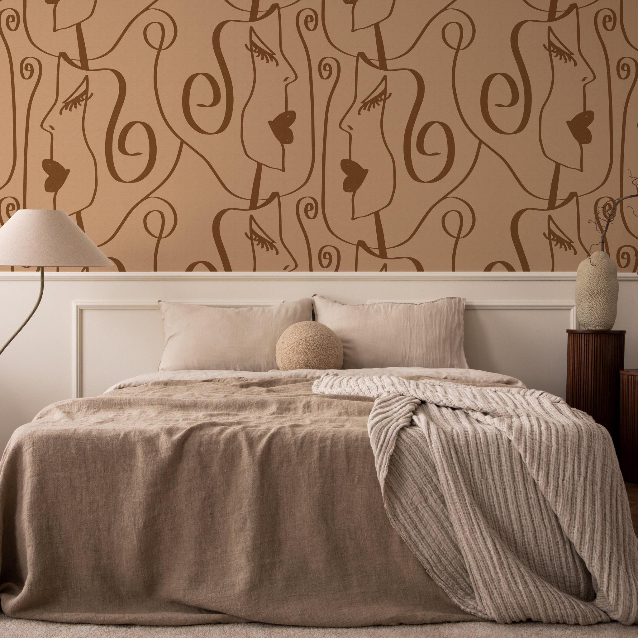 Tess Wallpaper by Wall Blush SG02 featuring artistic face patterns in a modern bedroom setup, emphasizing the wall design.
