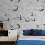 To the Moon Wallpaper by The Minty Line in a stylish bedroom, with focus on the lunar patterned design.
