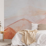 The Minty Line's Unruly Wallpaper in a cozy bedroom, showcasing serene earthy tones and an abstract design.
