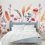 "Wall Blush's Untamed Wallpaper featuring botanical patterns in a cozy bedroom setting, accentuating warm decor."