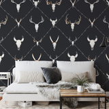 Alt text: "Elegant living room featuring Wall Blush's Wyatt Wallpaper with distinctive animal skull pattern."