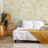 The Dutchess (Mustard) Wallpaper by The Ania Zwara Line in a stylish bedroom, showing large floral patterns.
