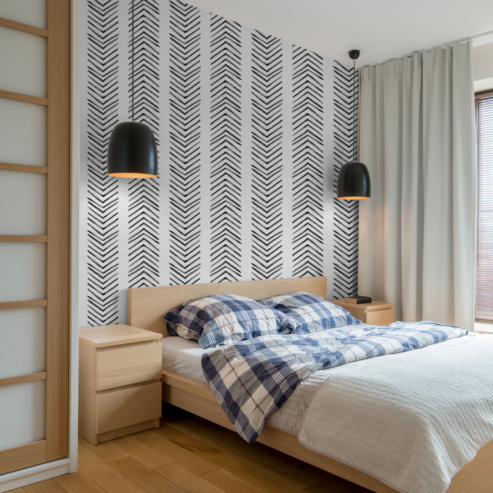 "Ar-row Wallpaper by Wall Blush accenting a modern bedroom decor with stylish design focus."