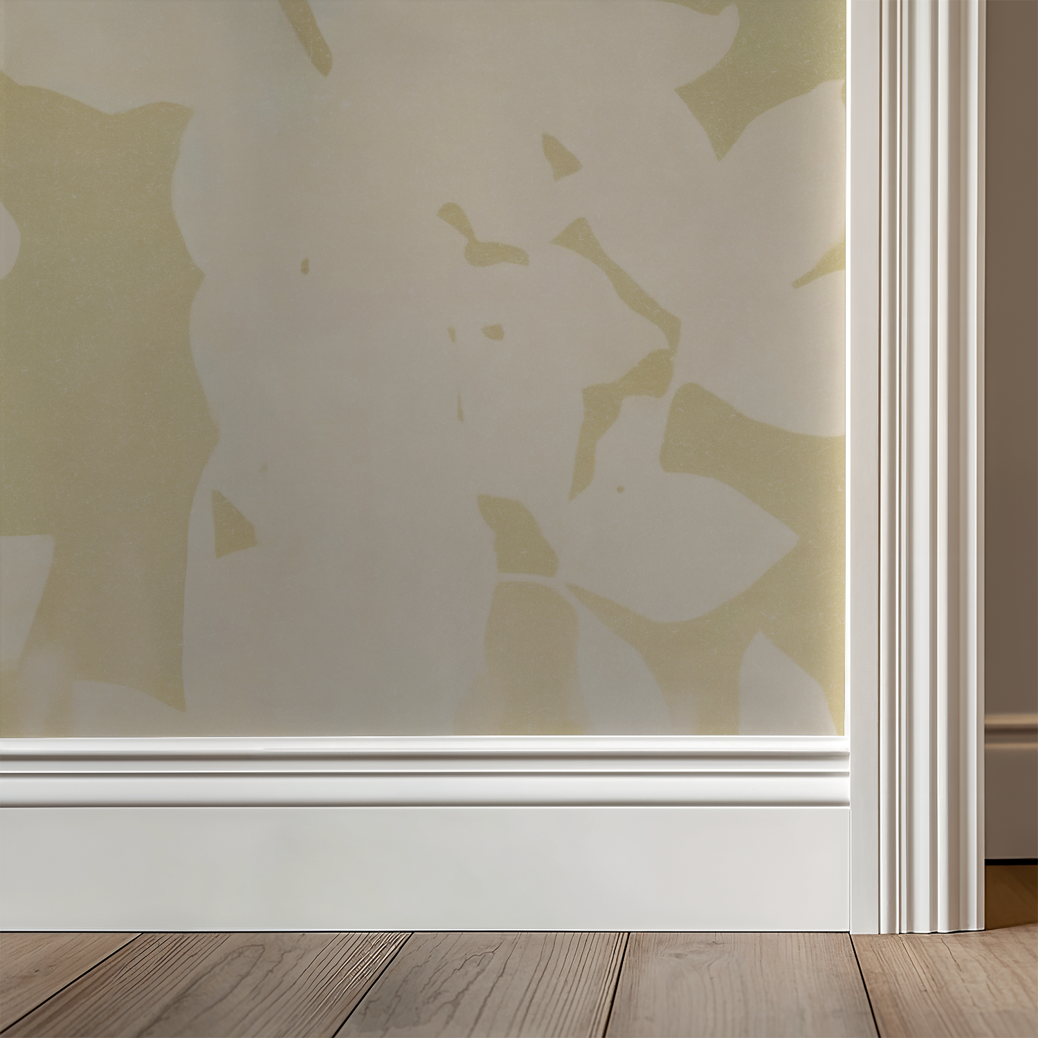 August Light wallpaper with soft gold and ivory floral pattern in a room setting.