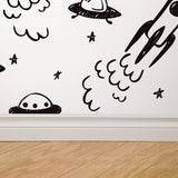 "Cosmo Wallpaper by Wall Blush in a kids' room featuring space-themed doodle designs, highlighting playful wall decor."