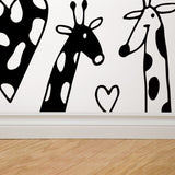 "Wall Blush Love You Long Time Wallpaper featuring playful giraffe designs in a nursery room setting."