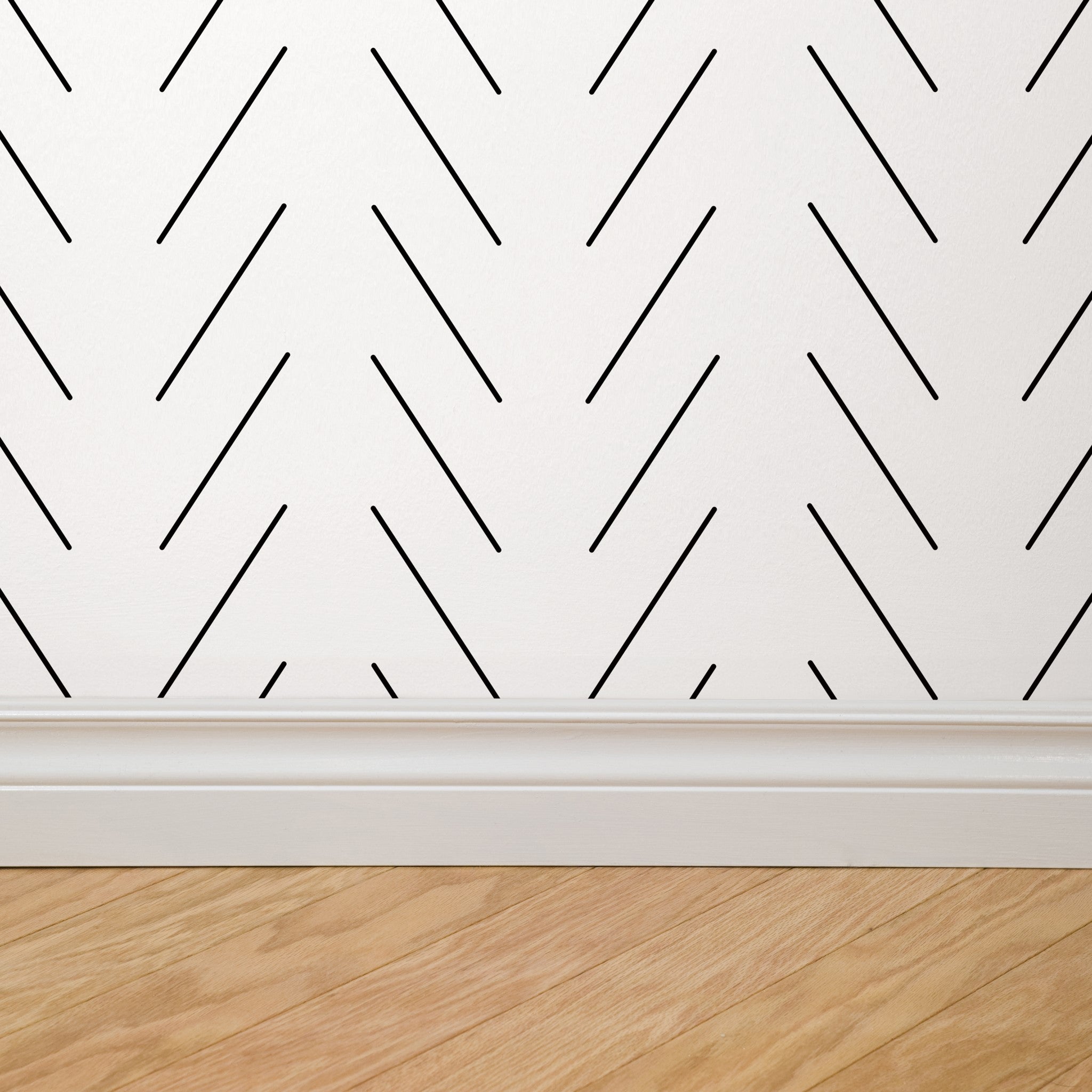 Oliver Wallpaper by Wall Blush on bedroom wall with abstract lines, modern decor focus.