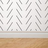 Oliver Wallpaper by Wall Blush on bedroom wall with abstract lines, modern decor focus.