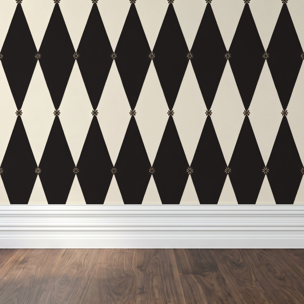 Black and white harlequin diamond pattern wallpaper in a modern setting.