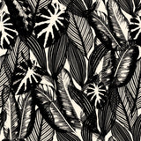 "Chloe Wallpaper by Wall Blush with tropical leaf design installed in modern living room, highlighting wall decor."