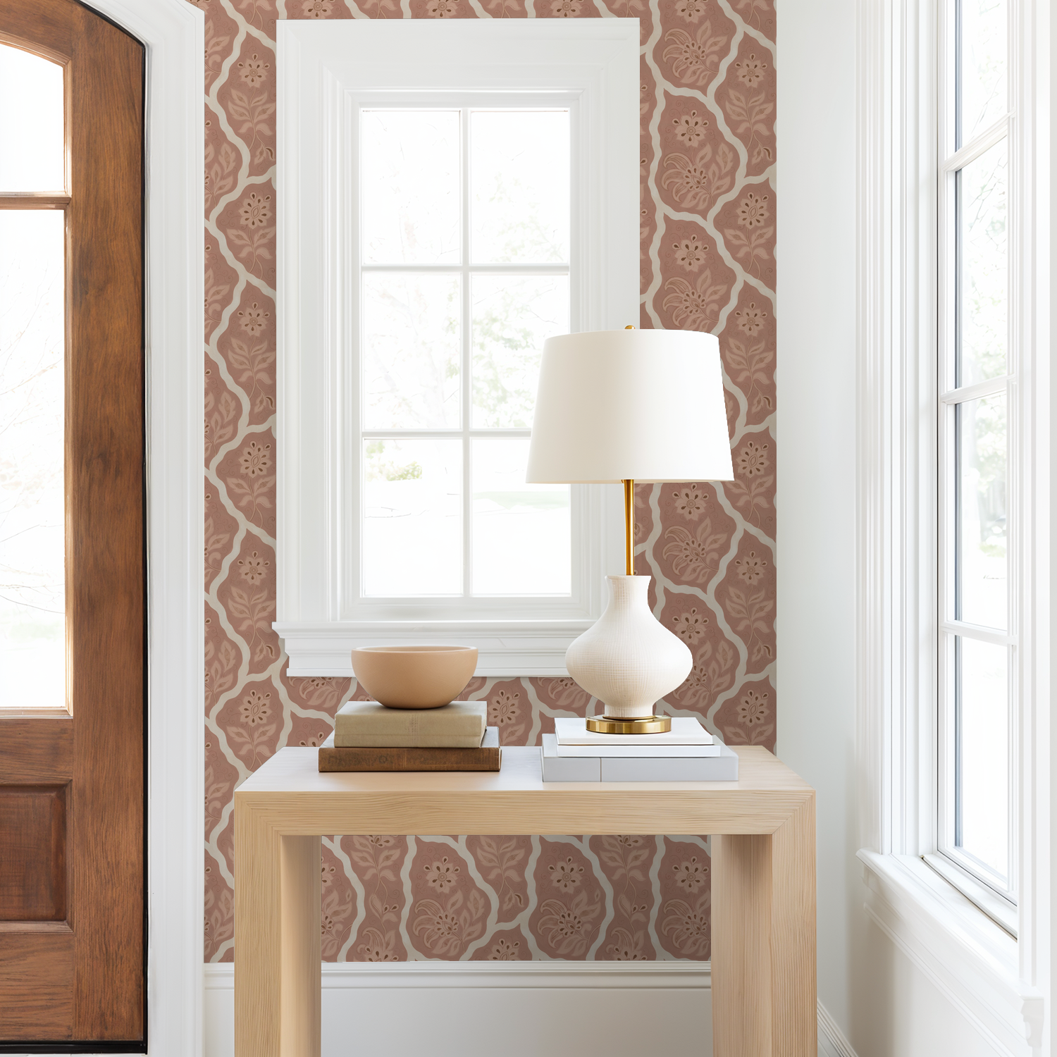 Bloomington wallpaper with intricate floral motifs in blush tones in a bright entryway.