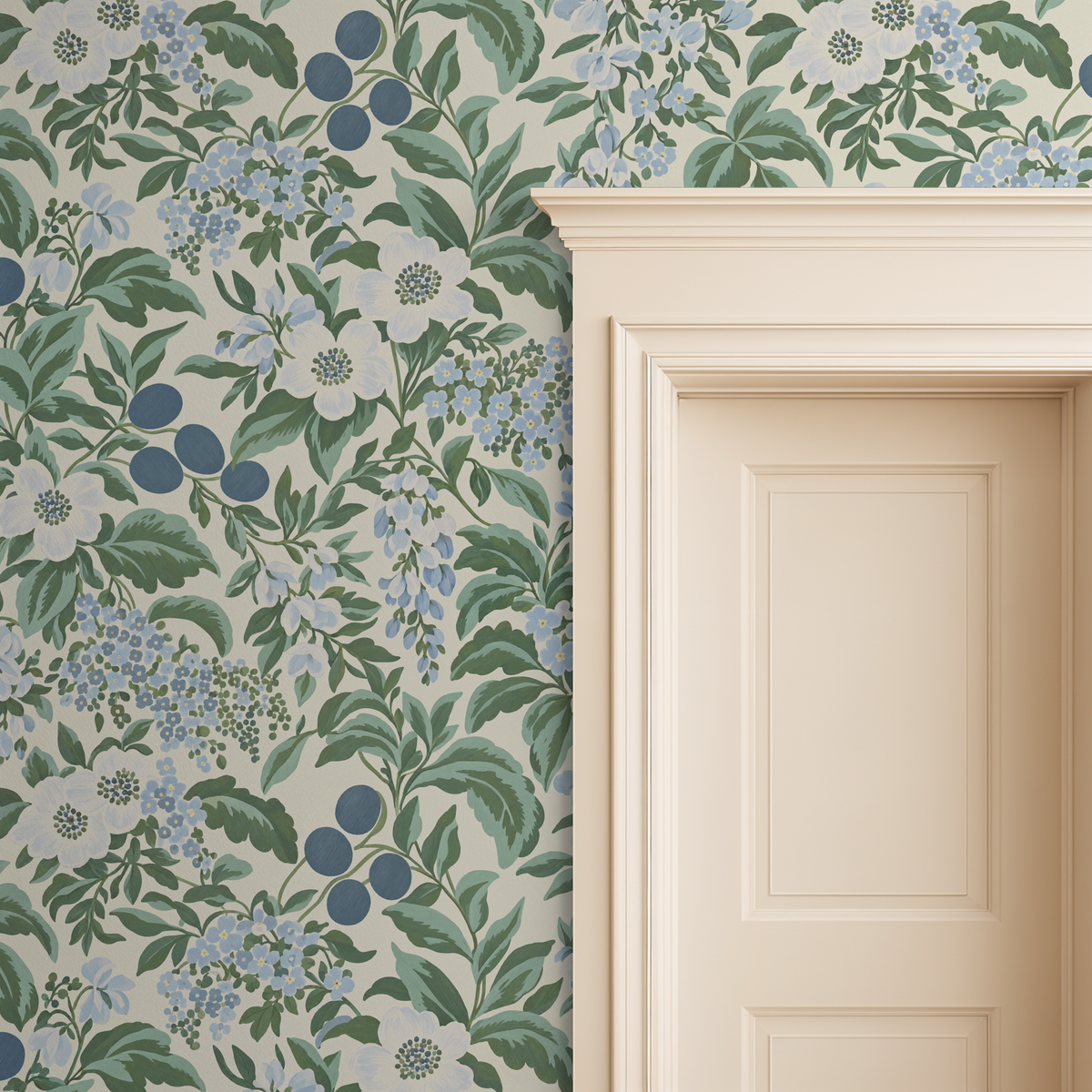 Bloomique Sage and Berry floral wallpaper with blue and green botanical pattern beside a cream door.