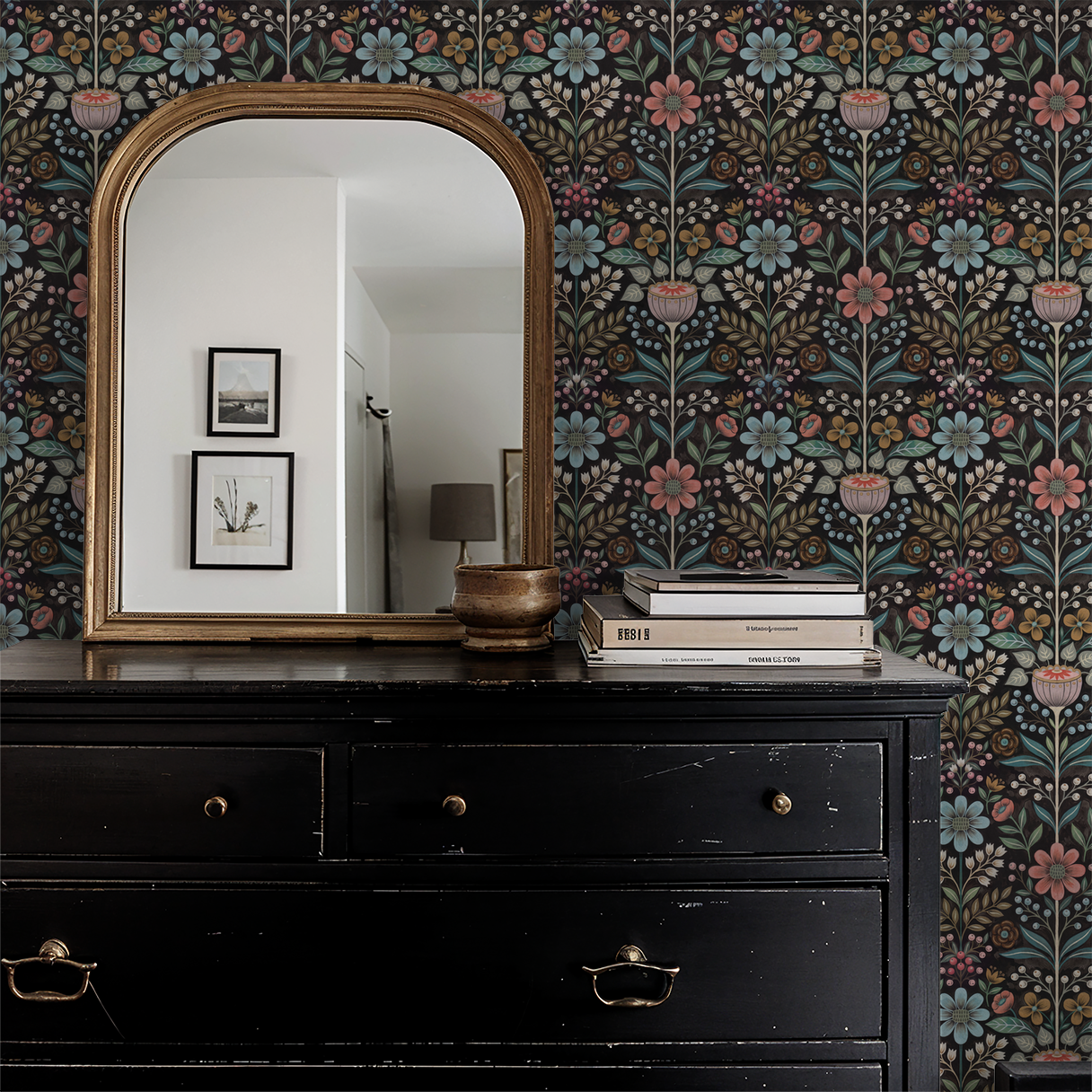 Bloomshire floral wallpaper with pink, blue flowers on black in vintage room with mirror.
