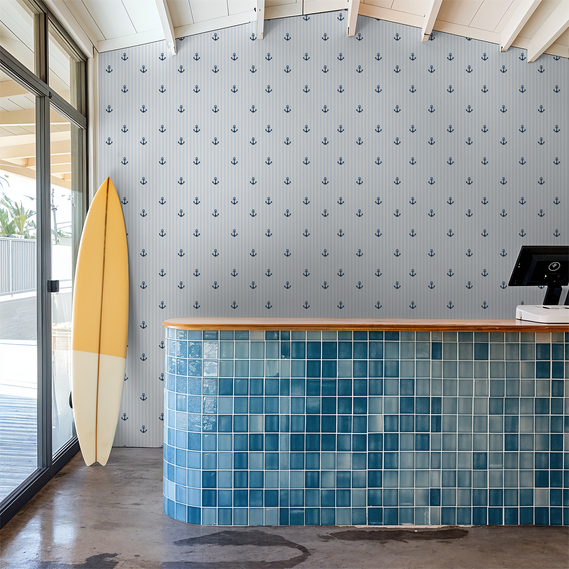 Nautical blue anchor wallpaper in coastal-themed room with surfboard.