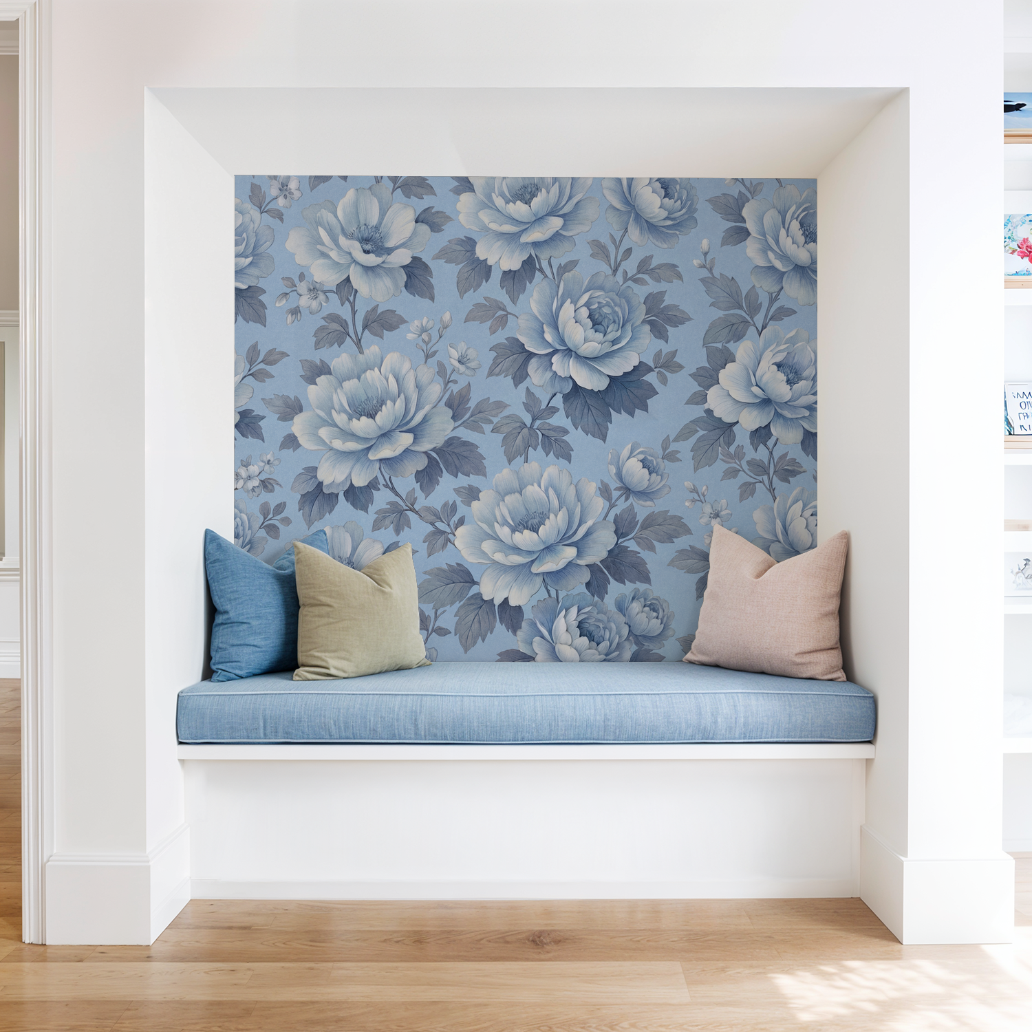 Blue floral wallpaper with peony design in a cozy nook with cushions.