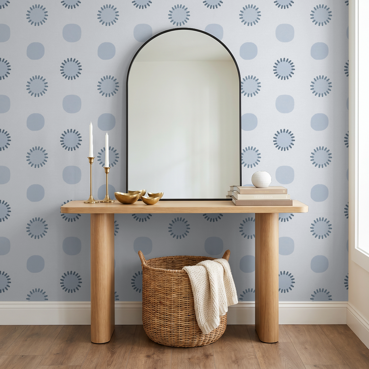 Blue geometric circle wallpaper in modern room with mirror and wooden table.