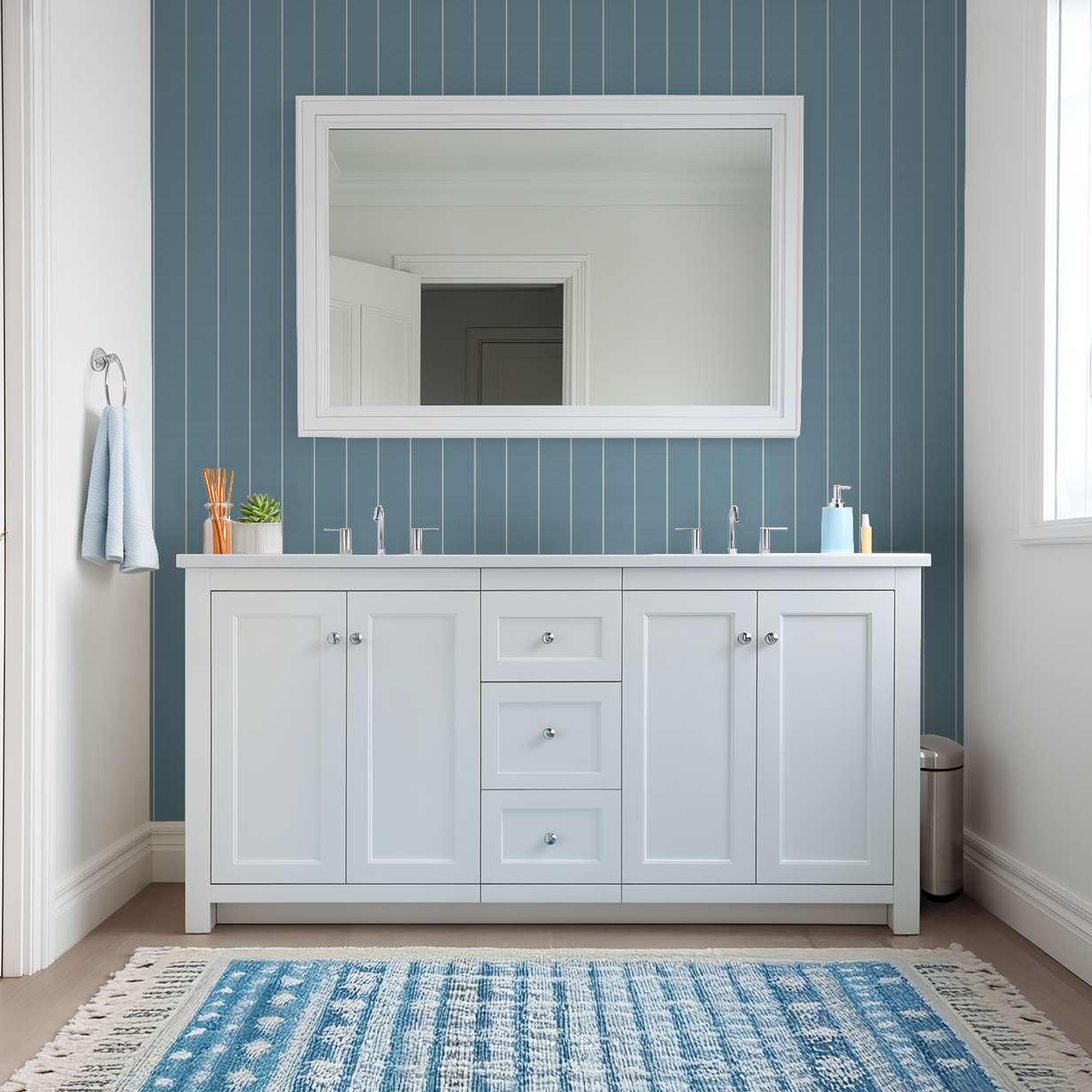 Blue pinstripe dot wallpaper in a modern bathroom with white vanity and mirror.