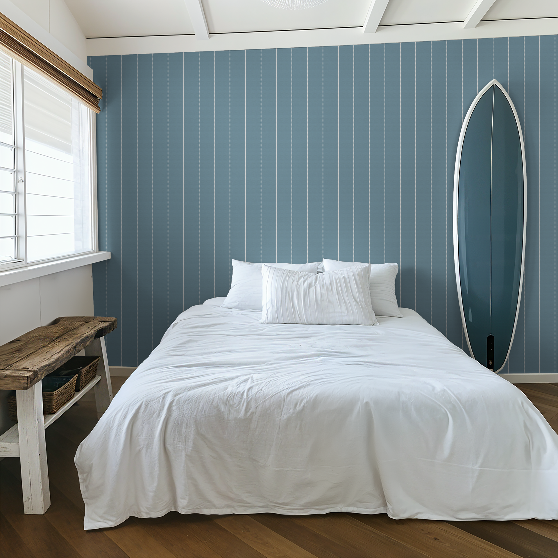 Blue pinstripe dot wallpaper in a modern bedroom with surfboard decor.