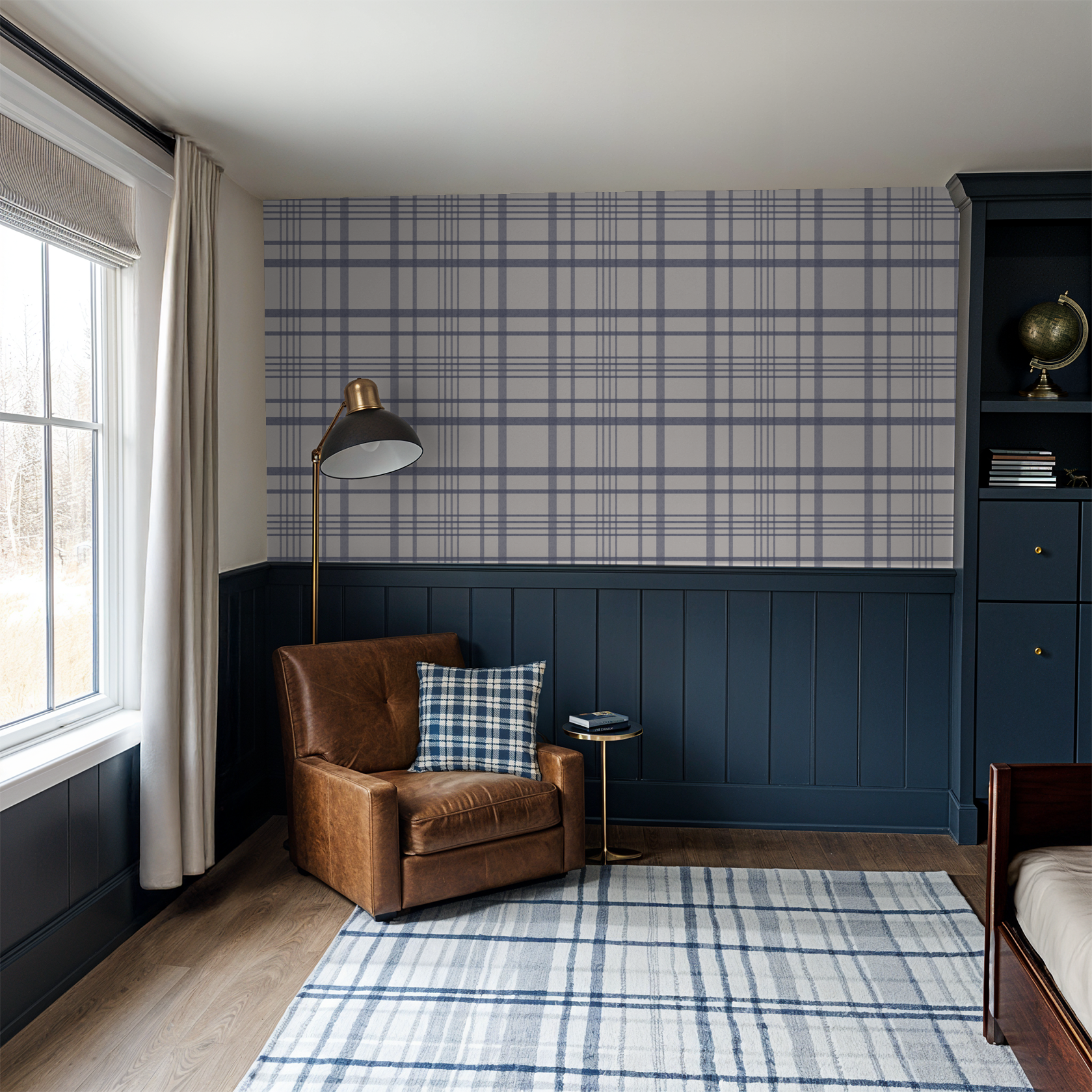 Blue plaid wallpaper in cozy living room with leather chair and plaid pillow.