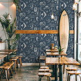 "Wall Blush Saltwater Surf (Blue) Wallpaper accentuating a stylish café interior, with focus on the decorative wall."