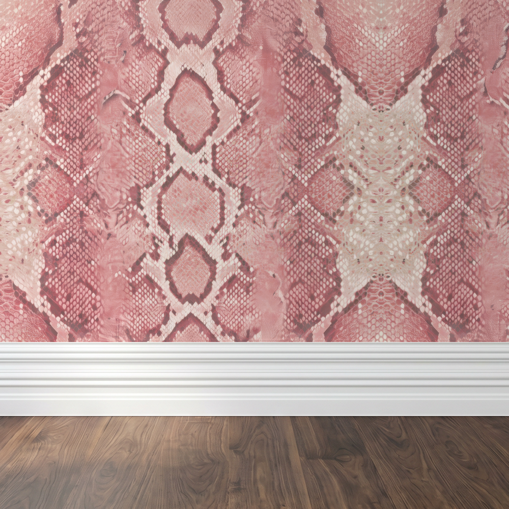 Blush Burmese snake pattern wallpaper in pink tones with wood floor