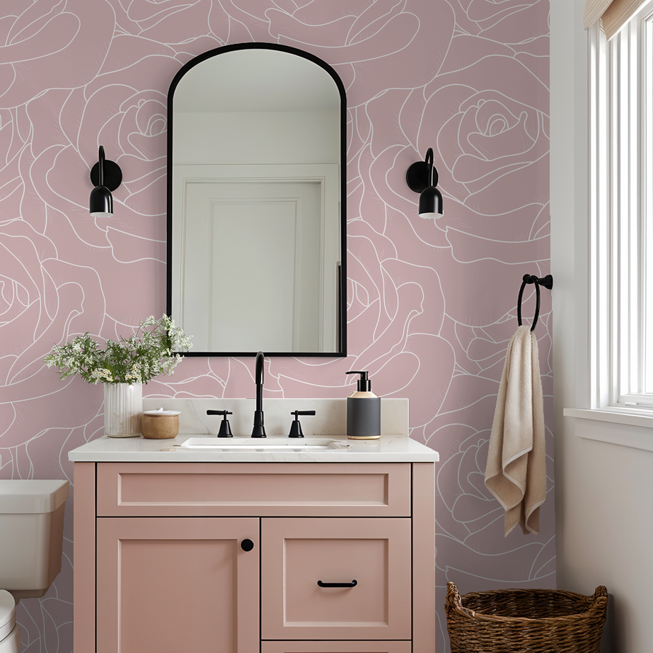 Blush pink floral rose wallpaper in elegant bathroom setting.