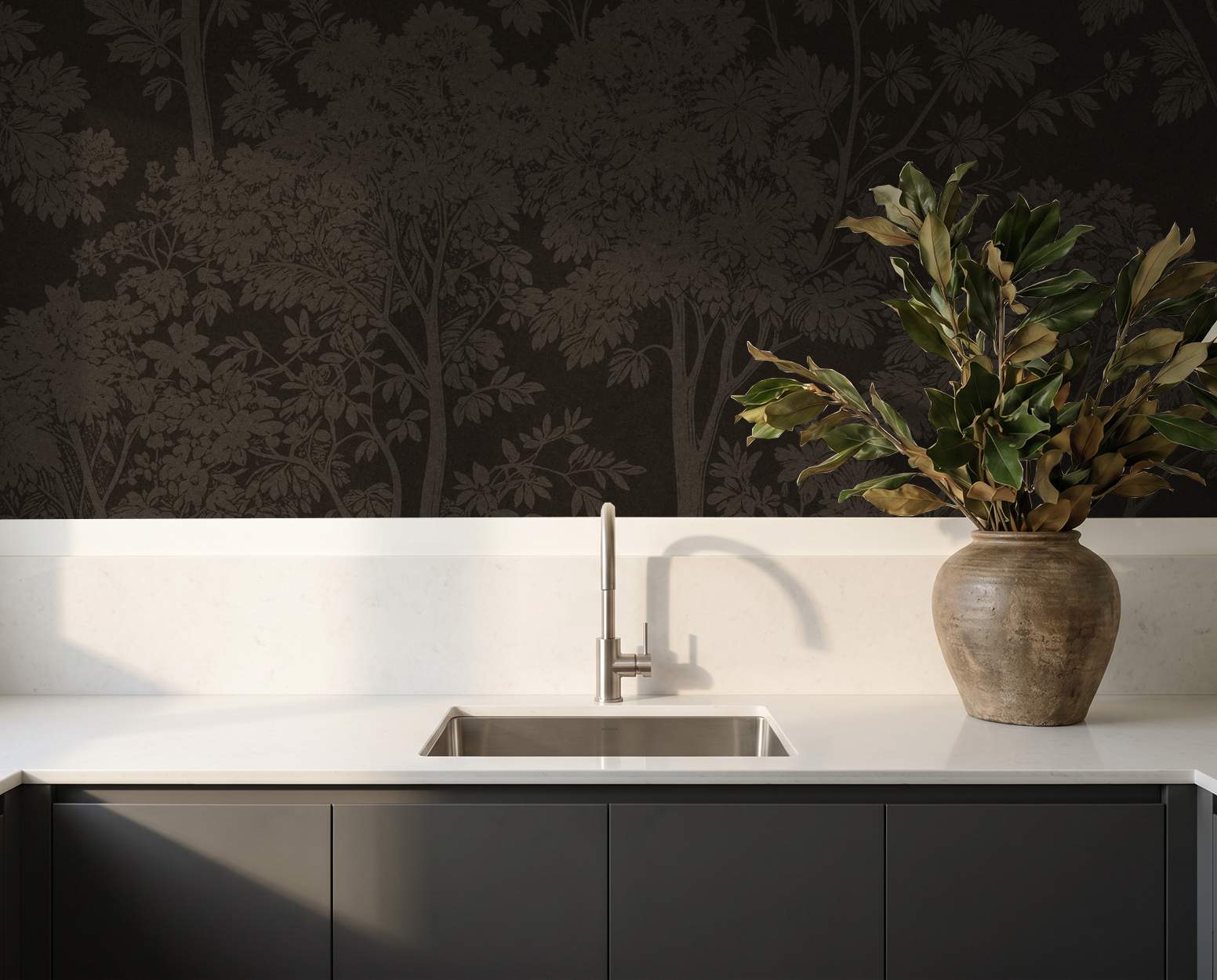 Bronze tree silhouette wallpaper in modern kitchen with vase and sink.