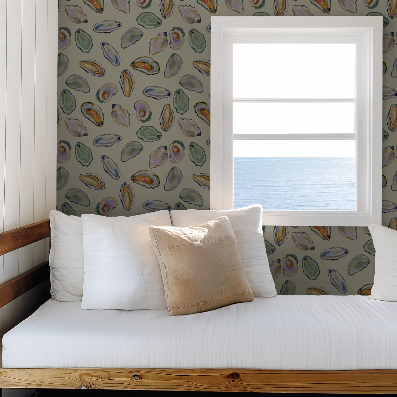 Coastal shell pattern wallpaper in a serene bedroom with ocean view.