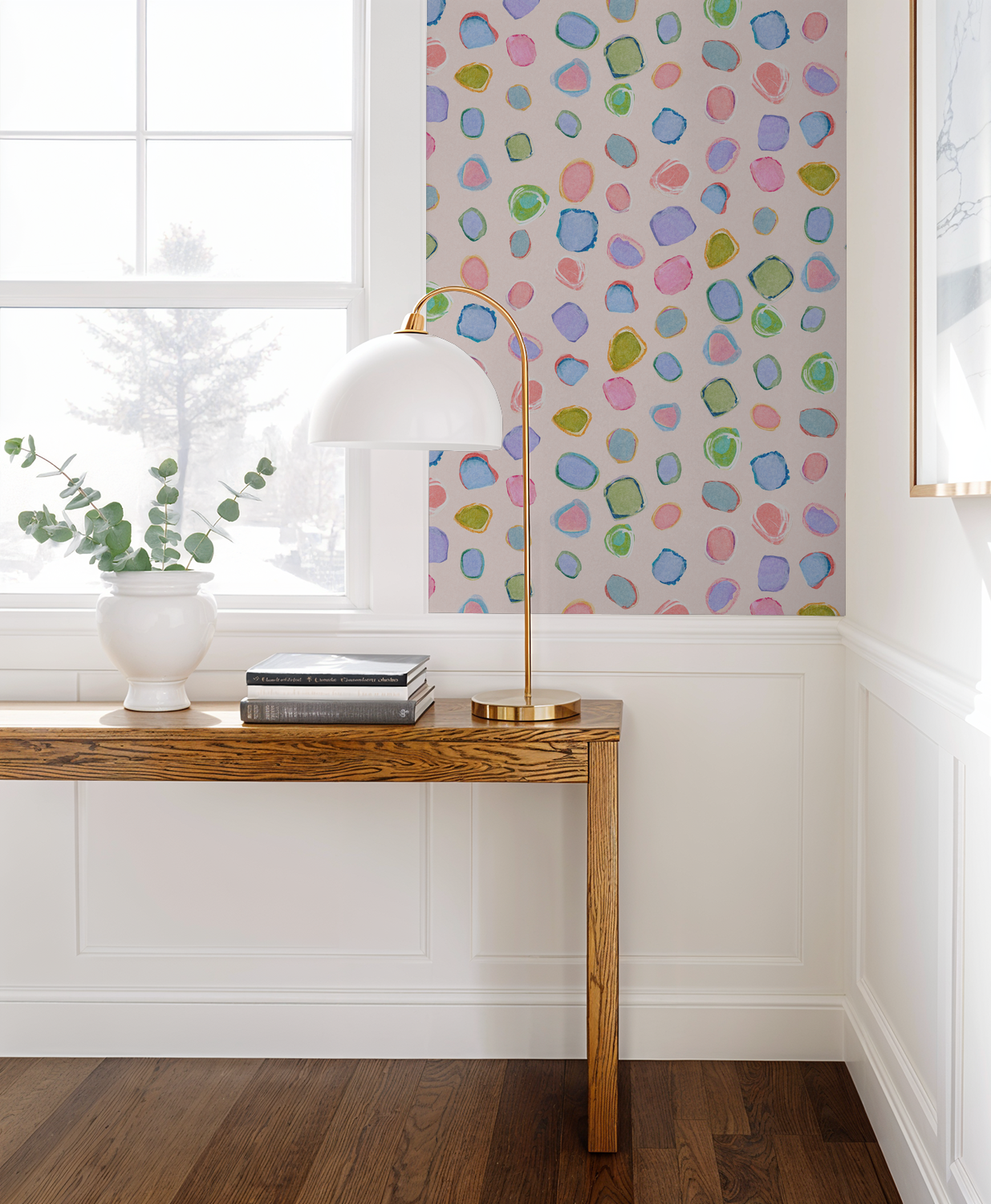 Colorful abstract pastel wallpaper in modern room with wooden table and lamp.