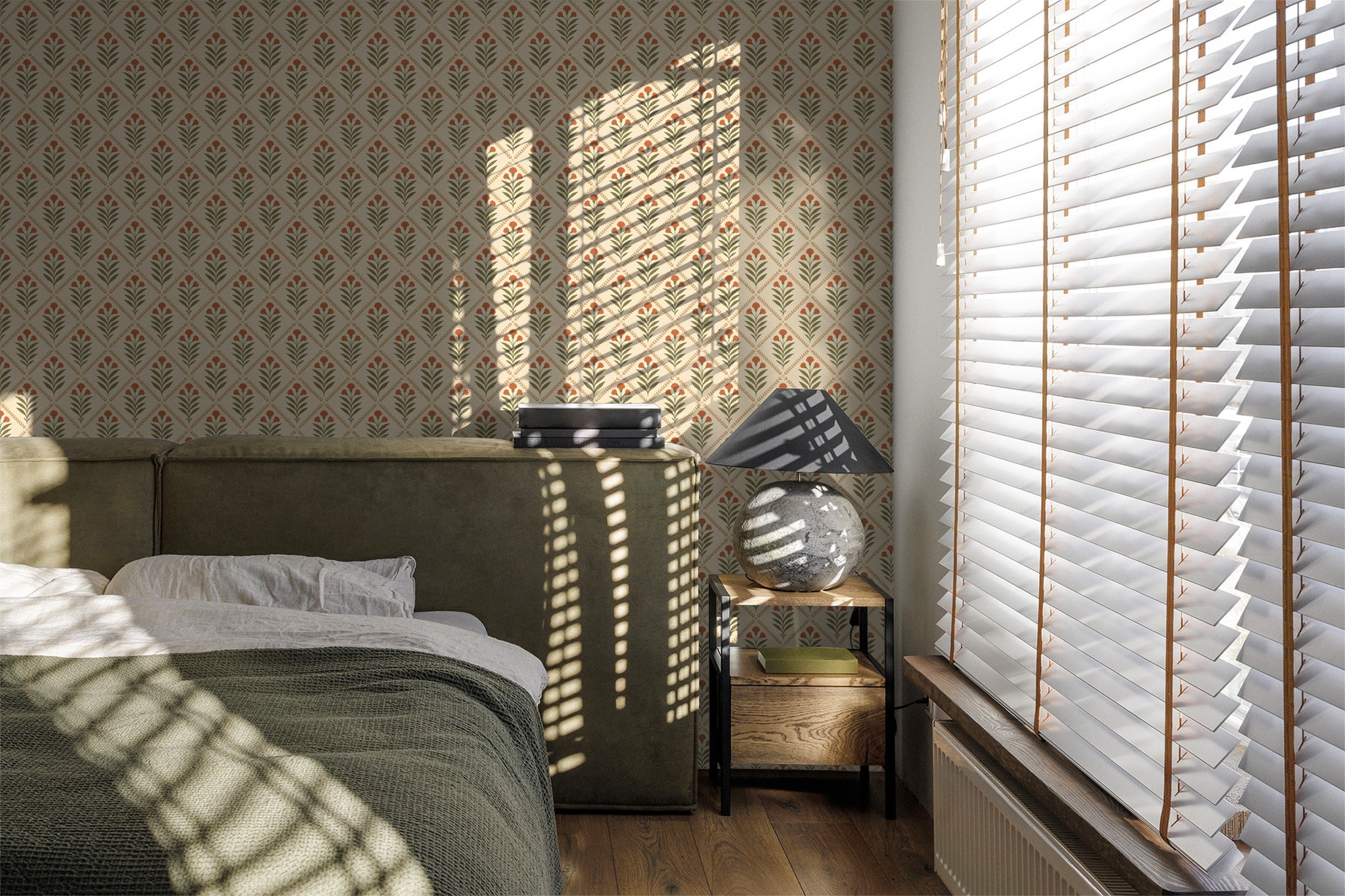 Bedroom with cream diamond wallpaper, olive leaves, terracotta blooms, sunlight through blinds.