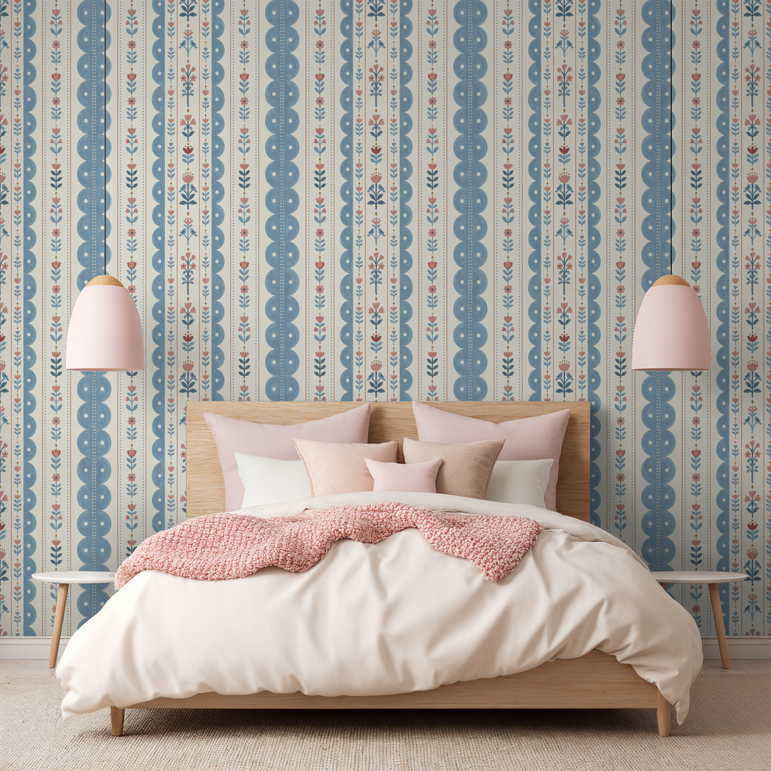 Dahlia Dreams wallpaper with blue and coral floral stripes in cozy bedroom.