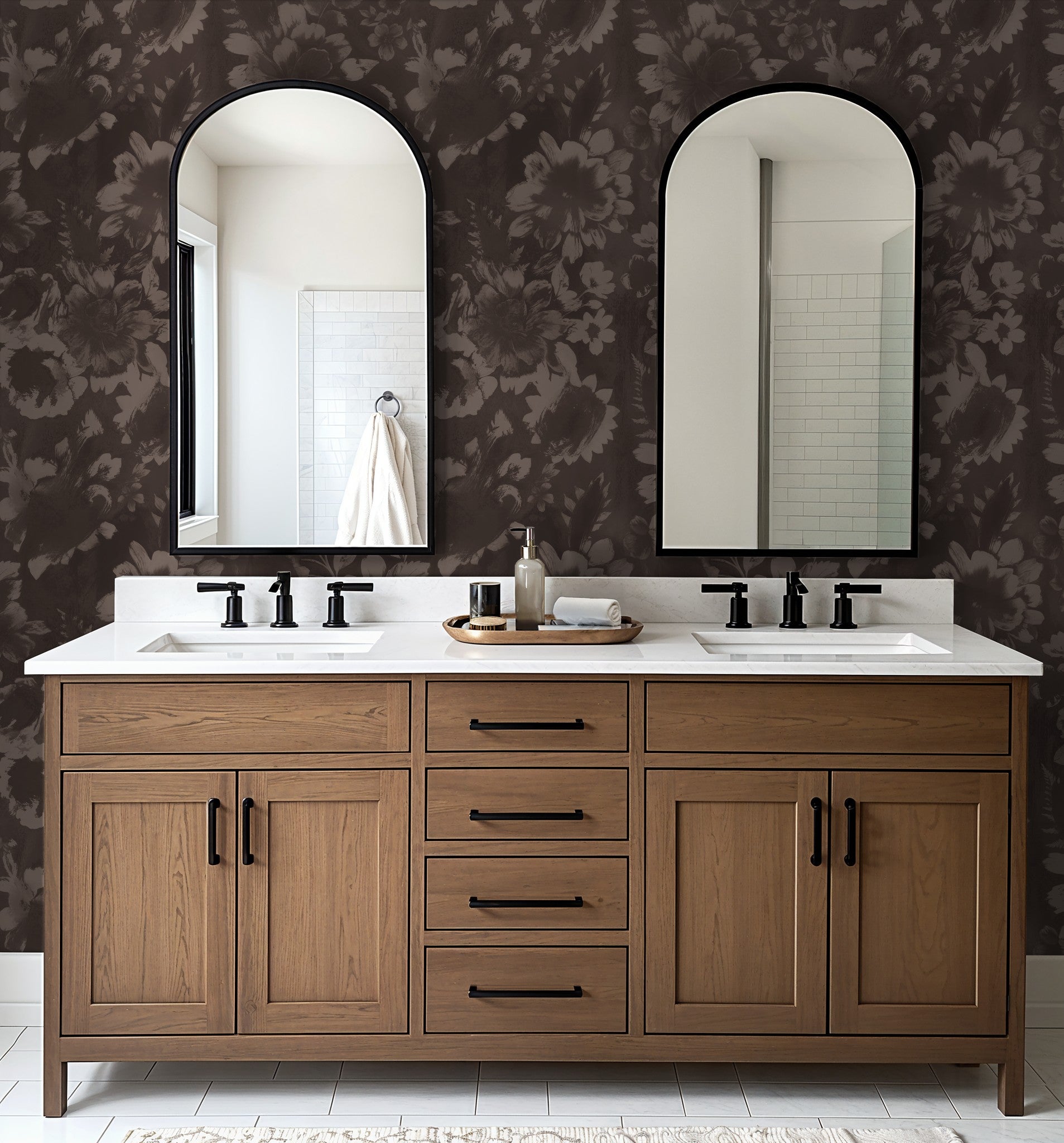 Dark floral wallpaper in bathroom with wooden vanity and mirrors.