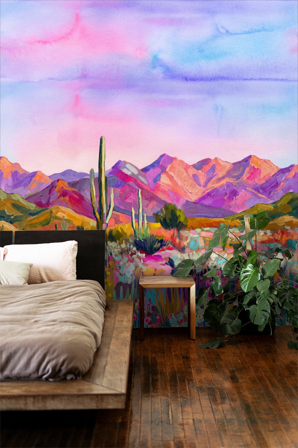 Desert landscape wallpaper with pink sky and mountains in a cozy bedroom setting.