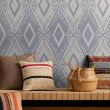 "Gloria Wallpaper by Wall Blush featuring geometric pattern in a cozy living room setting, focusing on stylish wall decor."